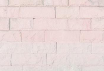 Empty Pink brick wall texture background in the bedroom at lovely. Brickwork stonework interior, rock old clean concrete grid uneven abstract weathered brick design, horizontal architecture wallpaper.