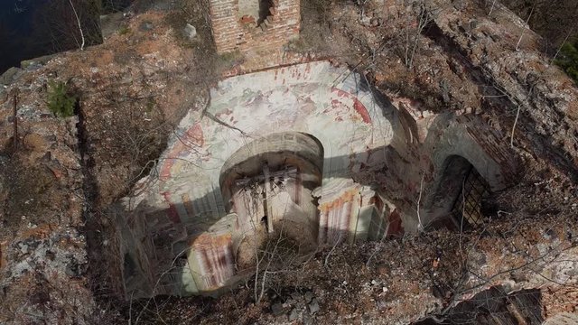 ancient cross on the background of the church ruins