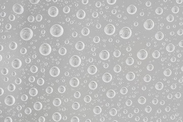 Water drops on gray background. Top view. Closeup.