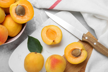 Naklejka na ściany i meble Delicious fresh ripe apricots on grey table, flat lay