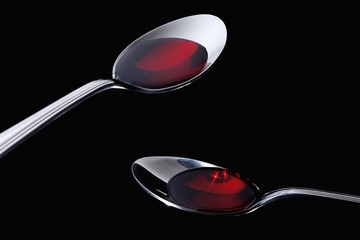 Two spoons with cough medicine