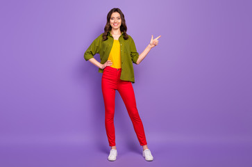 Fototapeta na wymiar Full length body size view of her she nice attractive confident cheerful wavy-haired girl demonstrating copy space ad advert isolated on bright vivid shine vibrant lilac violet purple color background
