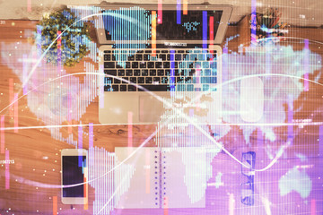 Business theme hologram drawings over computer on the desktop background. Top view. Multi exposure. Concept of international connections.