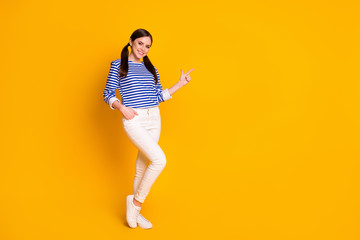 Fototapeta na wymiar Full body photo of positive girl point finger copyspace demonstrate advert promotion enjoy feedback sales discounts wear white good look clothes isolated over bright color background
