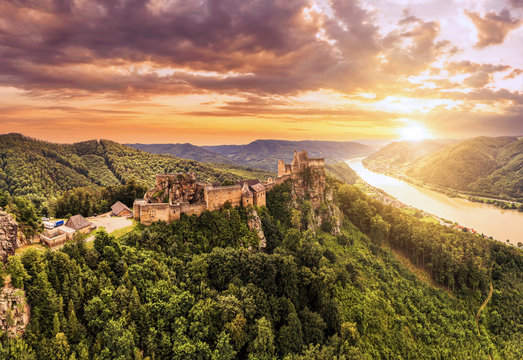 Beautiful landscape with Aggstein castle ruin and Danube river at sunset in Wachau walley Austria. Amazing historical ruins. Original german name is Burgruine aggstein. Little castle in english.