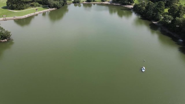 Rising aerial reveal of Castlewellan Lake and Forest Park
