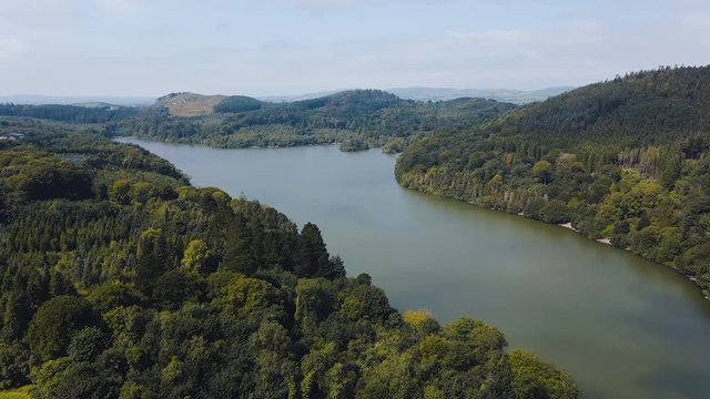 Panning aerial view of Castlewellan Lake and Forest Park, County Down