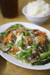 Asian dish of vegetables and a bowl of rice