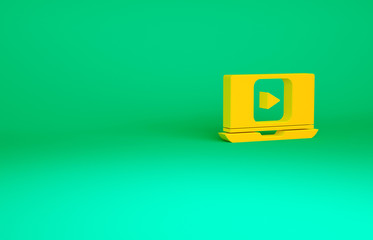 Orange Online play video icon isolated on green background. Laptop and film strip with play sign. Minimalism concept. 3d illustration 3D render.