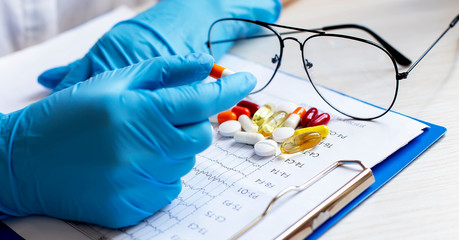 Close up hands doctor take pills, tablets.healthcare. Medical concept