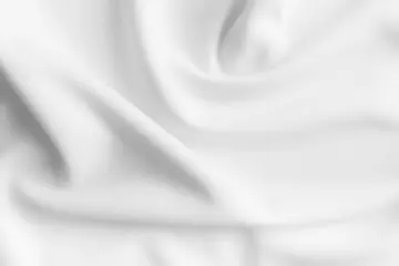 Rolgordijnen White abstract wavy clothes background. fabric texture © Kavik