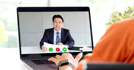Fototapeta na wymiar Video conference, Work from home, Businessman making video call to employee with virtual web, Contacting manager by conference on laptop computer at home, Talking on web, Online consultation business