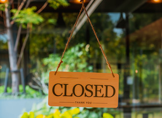 closed sign on door entrance cafe restaurant or business office store is closed due to the effect of coronavirus covid-19 pandemic