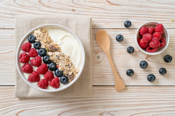 homemade yogurt bowl with raspberry, blueberry and granola