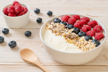 homemade yogurt bowl with raspberry, blueberry and granola