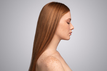 Profile of calm ginger female