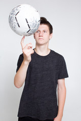 A young guy in a black sports t-shirt and shorts