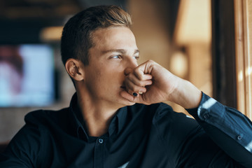 Business man in black shirt emotions cafe official