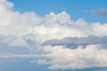 white cumulus clouds in the blue sky