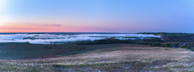 sunrise, fog over the river panorama of the landscape in the early morning. pink sky before sunrise . background image