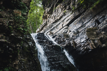 Obraz premium Waterfall in the Ukrainian Carpathians (Gorgany mountain range). Bukhtivets waterfall