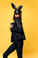 Sexy woman in rabbit mask and black suit, temptation