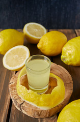 limoncello drink on black wooden surface