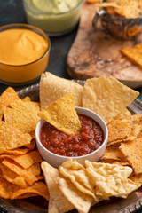 Snacks and chips close-up with salsa, rest and snack for beer, Mexican food
