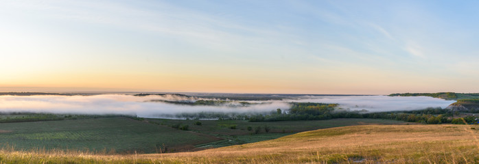 sunrise, fog over the river panorama of the landscape in the early morning. pink sky before sunrise . background image.