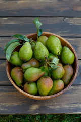 fresh pears in a wooden bowl