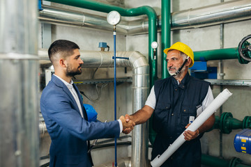 industry worker and supervisor handshake