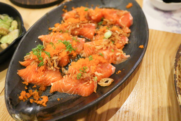 Spicy Salmon on black plate