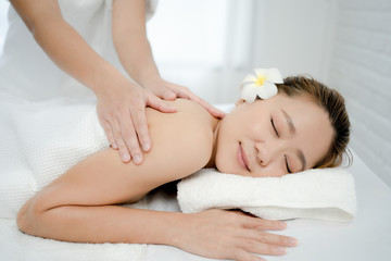 Fototapeta na wymiar Beautiful Asian woman having a hand massage at the spa. She felt relaxed while massaging.