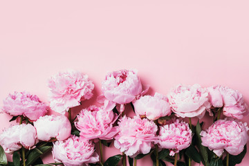 Floral pattern, frame made of beautiful pink peonies on wooden white background. Flat lay, top view. Valentine's background. Floral frame. Frame of flowers. Flowers texture © jchizhe