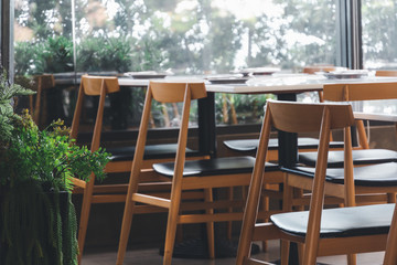 Empty Table row  in restaurant. Table and row in Cafe and restaurant interior.