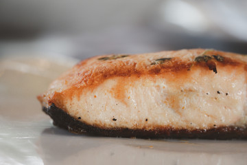 Close up well done grilled salmon slice.  Background for food and seafood restaurant.