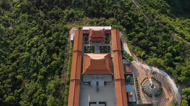 Tilt reveal aerial view of A-Ma Temple and Macau and Zhuhai cityscape