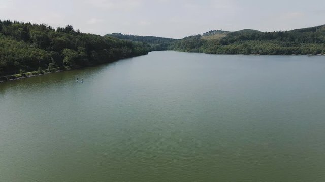 Rotating aerial view of Castlewellan Lake and Forest Park