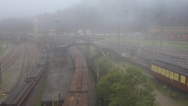 freight trains move on the lines, at historic village of Paranapiacaba, under fog. Old railway station. Santo Andre, Brazil