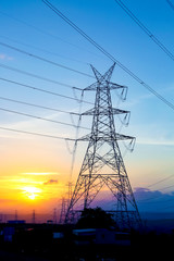 Fototapeta premium high-voltage power lines at sunset,high voltage electric transmission tower
