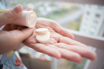 Woman with a medical tablet in hand close up.