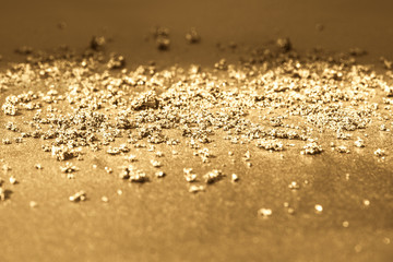 Dust on a gold background.