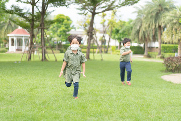 Fototapeta premium 3 brothers are running and playing in the garden.