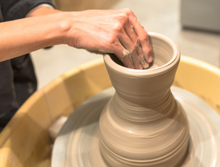 Fototapeta na wymiar hands of a potter at work