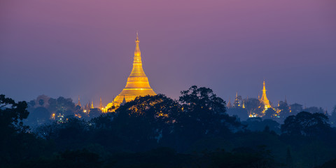 Panorama of the Shwedagon pagoda illuminated at night, in Yangon Burma Myanmar
