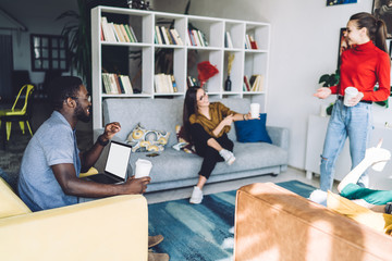 Group of multiracial friends having fun in lounge