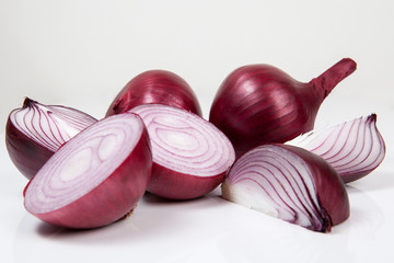 Obraz na płótnie Canvas Red onion on the white wooden background.