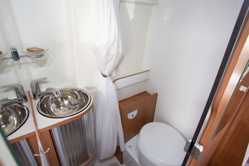 Modern camper inside van interior of bathroom toilets in new motorhome