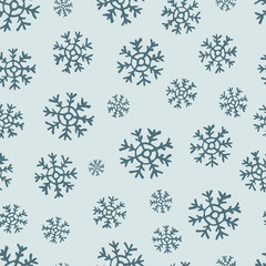 Seamless background of hand drawn snowflakes