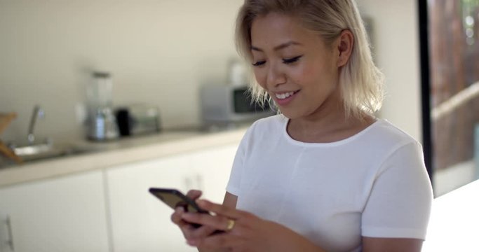 Young woman makes a video call with her friend who she hasn't seen in quite some time and happy to speak with her. Technology, young generation, connection